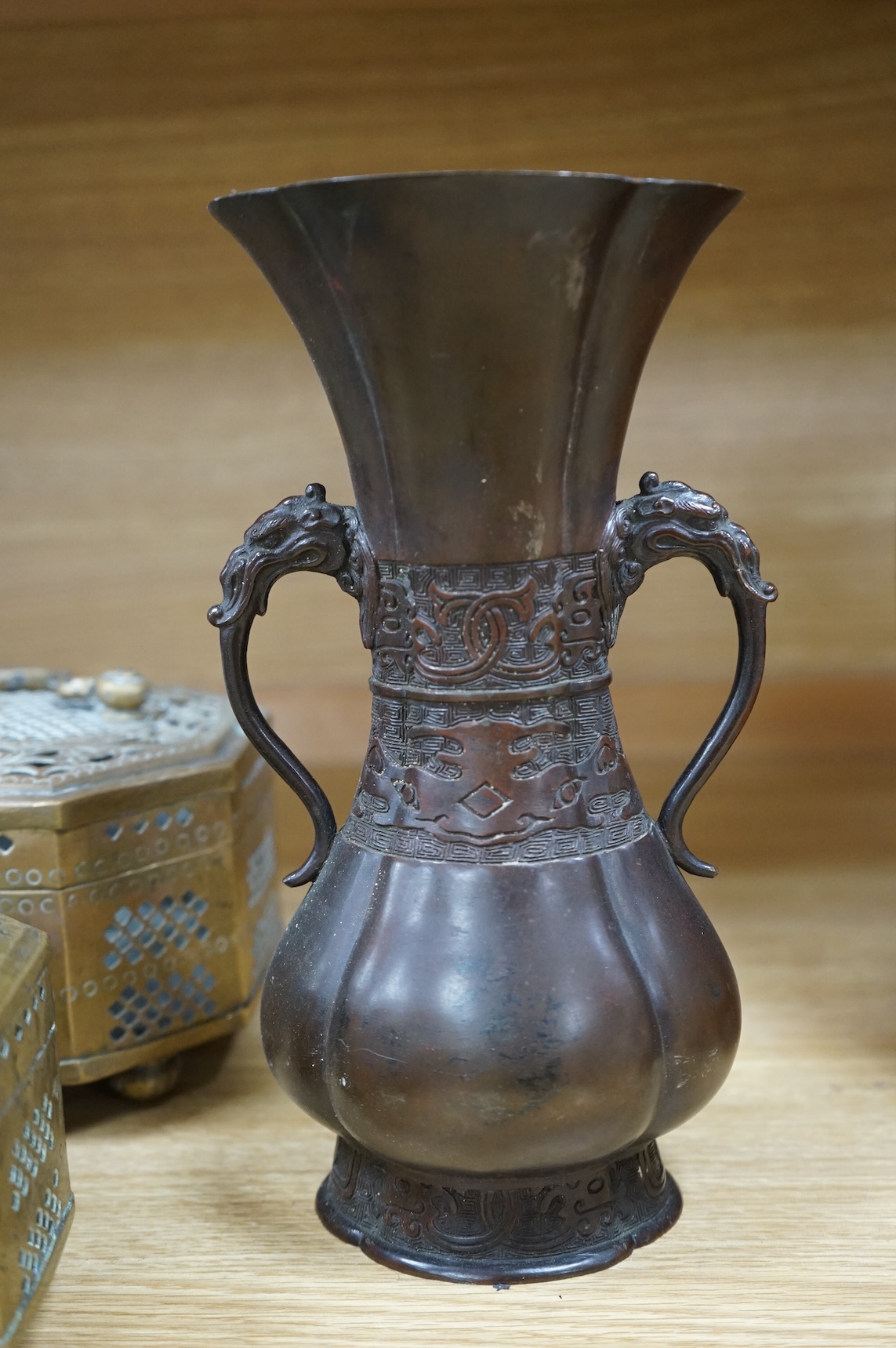 A Japanese archaistic bronze vase, seal mark to base, together with two Indian brass Paan boxes and a Medieval revival bronze casket, tallest 26cm